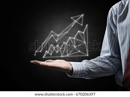 Close of businessman hand showing in palm glowing chart sign