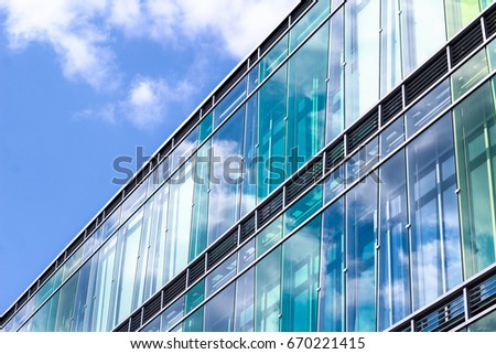 Business buildings detail - architecture with sky reflection background
