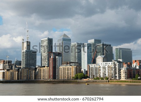 Wide river canal, city skyline, residential buildings on the other side of the shore, beautiful district, architecture