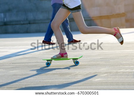feet girls skateboarding in the city