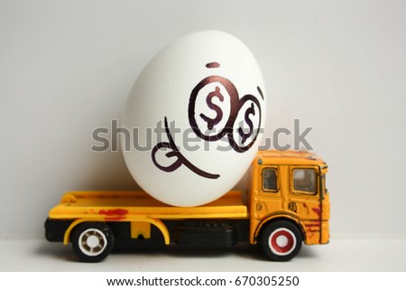 Business concept. Business transportation. A happy egg with a painted face on a yellow car with its tongue hanging out