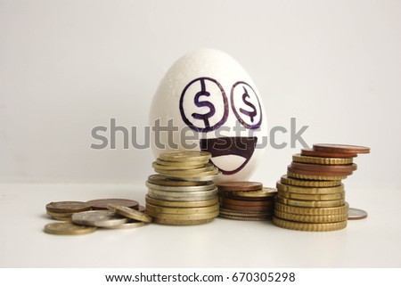 Business concept money. A very happy egg with coins. Photo for your design