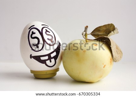business idea. A new idea, a project. An egg with a face and eyes with dollars and an apple. Money apple. Photo for your design
