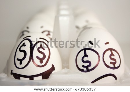 Business concept team. Eggs with a painted face.