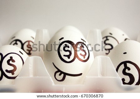 Concept of business and businessman. An egg with a painted face and a tongue