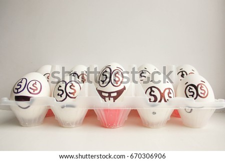 Concept of business training. Seminars and groups of students. Eggs with painted face.