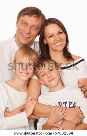 nice smiling family of four on a light background