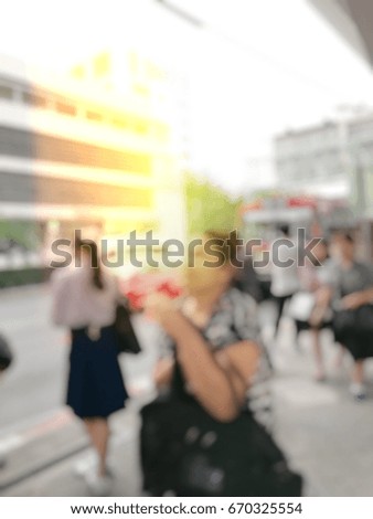 Abstract blurred image background of People and students waiting for the bus for go to working in the evening rush hours. Monday morning