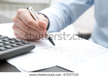 Businessman doing some paperwork in his office