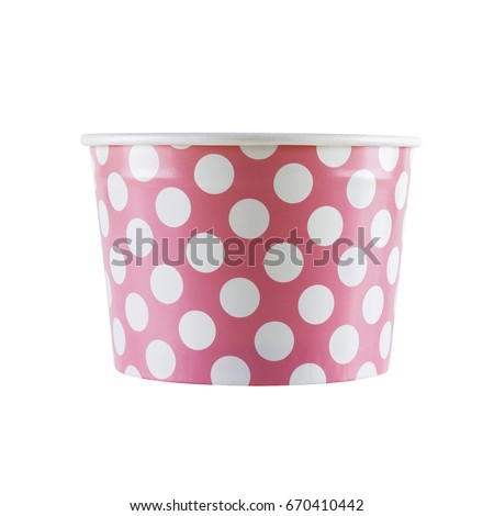 Pink disposable paper cup with polka dots on a white background. Clipping path.
