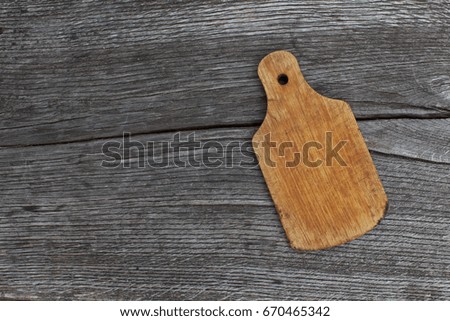 vintage cutting board with space for text on old wooden background