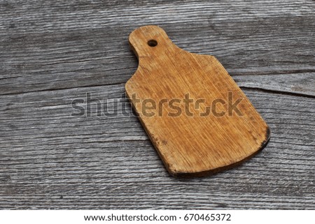 vintage cutting board with space for text on old wooden background