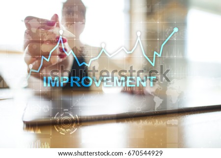 Improvement graph on virtual screen. Business and technology concept. 