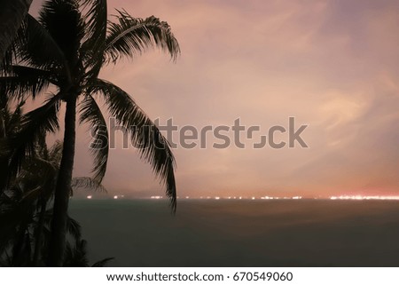 Beauty in Nature of coconut palm tree silhouette after sunset at the beach.