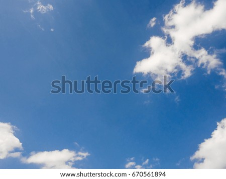 Blue vivid sky with white clouds in day light.