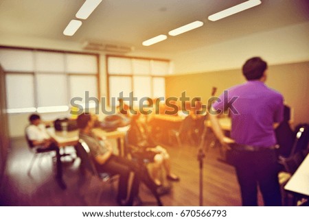 Abstract blur education meeting, business, student and people in classroom in university. teacher lecture meeting group background. Vintage tone color and light effect.