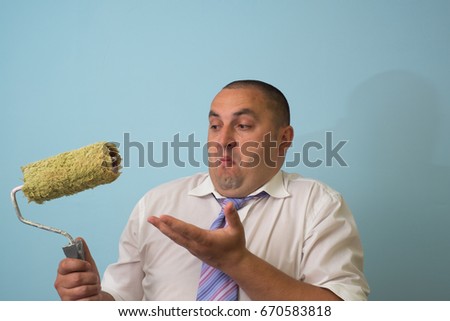 Businessman with paint roller