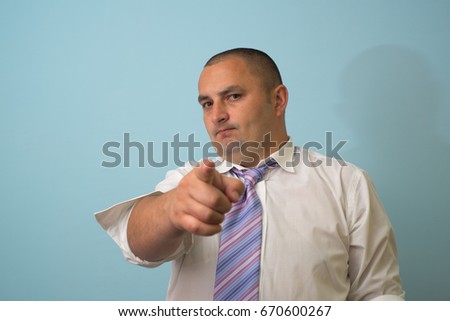 Business man aggressive pointing index finger on white background