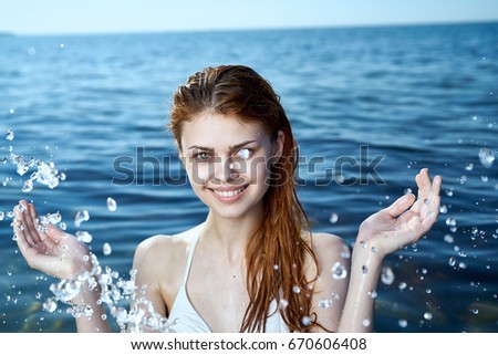 Young beautiful woman on vacation at sea