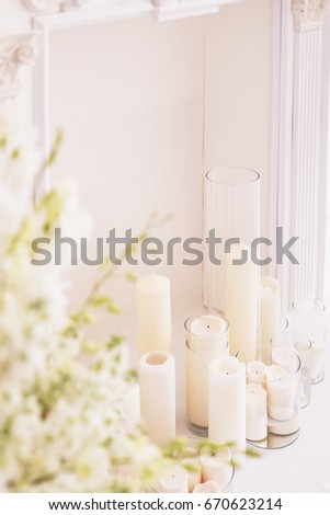 wedding decor, candles and flowers, white false fireplace