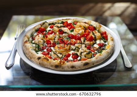 Seafood pizza with white wine