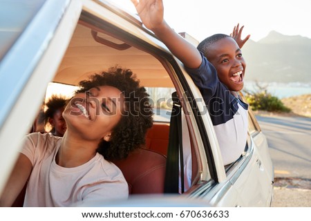 Mother And Children Relaxing In Car During Road Trip Royalty-Free Stock Photo #670636633