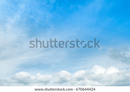 Blue sky with clouds closeup and background.