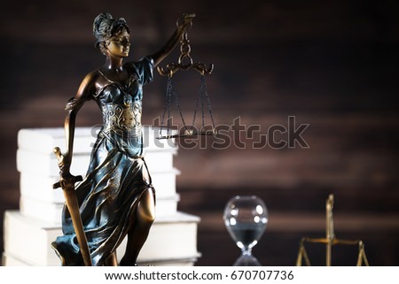 Lady justice on wooden background