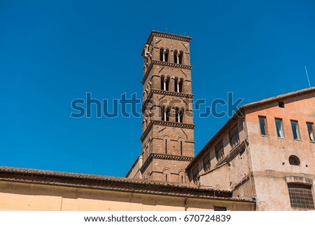 Tower of Santa Francesca Romana church viewed from low angle against clear blue sky in Rome, Italy