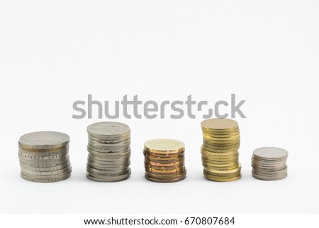 Five stack of coins in the white background. Unequal height.