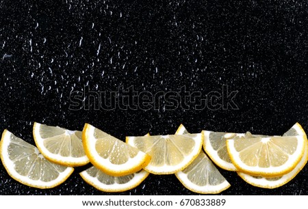 Lemon slices lays on a bright background there is a place for an inscription