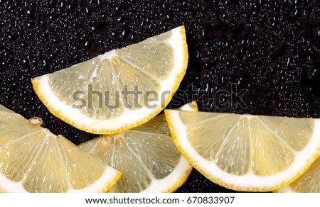 Lemon slices lays on a bright background there is a place for an inscription