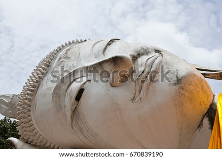 The face of a huge white Buddha at the ancient temple in Thailand
