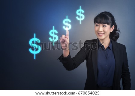 Beautiful Business Woman touching finance money bottom sign on virtual screen