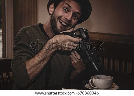 man taking photo coffee by professional camera
