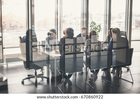 young business people group have meeting and working in modern bright office indoor Royalty-Free Stock Photo #670860922
