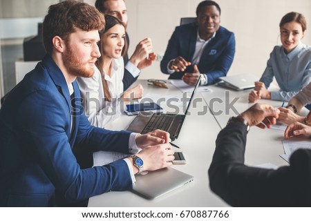 african leader coaching and teaching in modern office. On the job training. Business and Education concept. Royalty-Free Stock Photo #670887766