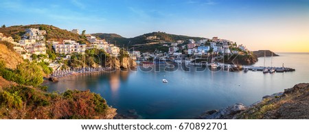Panorama of Harbour with vessels, boats, beach and lighthouse in Bali at sunrise, Crete, Greece