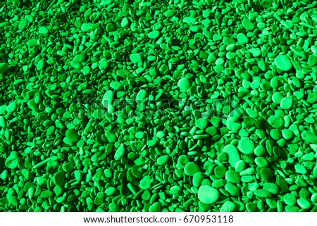 Green colored stones of the beach of Aphrodite. Souvenirs as a gift. The rock of the Greek (Petra tou Romiou). Paphos region. Cyprus island. Background