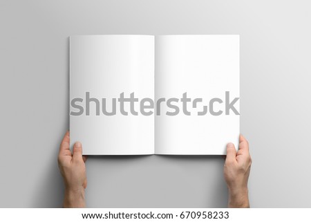 Blank A4 photorealistic brochure mockup on light grey background.  Royalty-Free Stock Photo #670958233