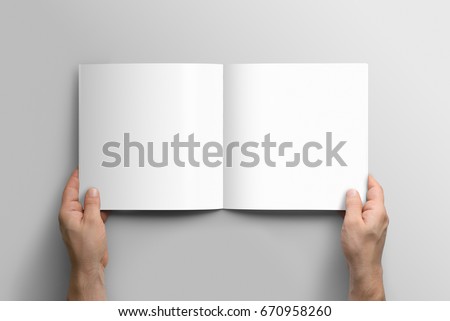 Blank square photorealistic brochure mockup on light grey background.  Royalty-Free Stock Photo #670958260