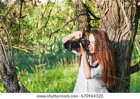 Happy young woman in field. Nature background