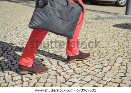 Woman walking zebra crossing outdoors background. Safe commuting sidewalk travel transportation