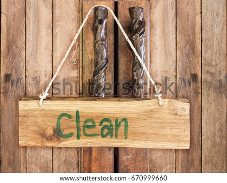 Wooden sign with "do not disturb" hang on door.