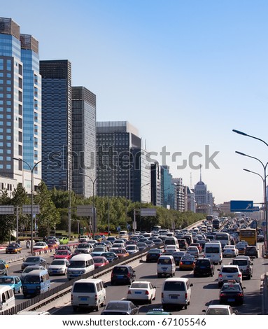 Beijing skyline and traffic jam on ring road. China
