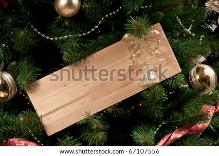 a wooden board on x-mas tree