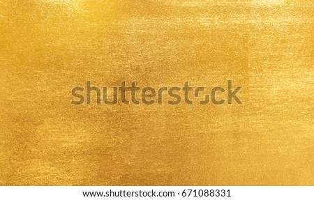 Shiny yellow leaf gold foil texture background Royalty-Free Stock Photo #671088331