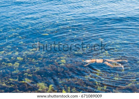 Blonde hair woman snorkeling in Black Sea