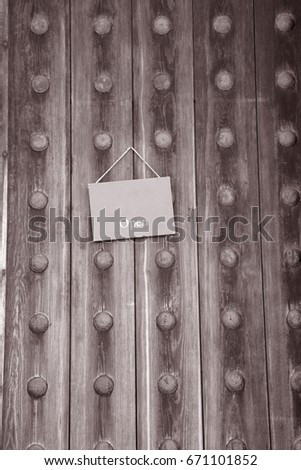 Open Sign on Wooden Door in Black and White Sepia Tone