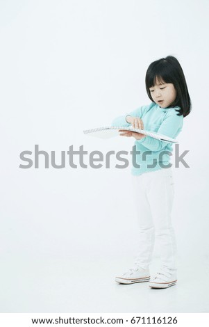 Girl with drawing paper 
